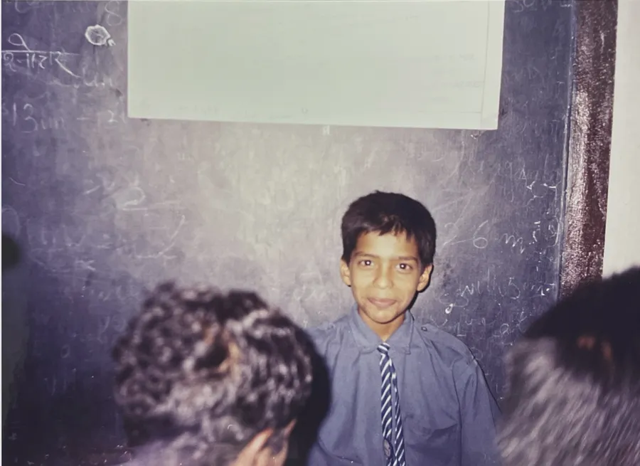 Young Praveen Kumar Gorakavi at the blackboard — where a lifetime of invention began